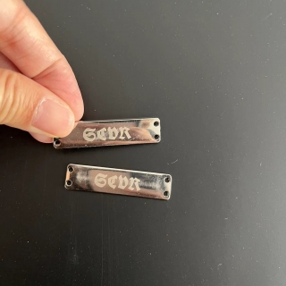 silver metal tags